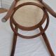 Curved wooden bistro and canne seating