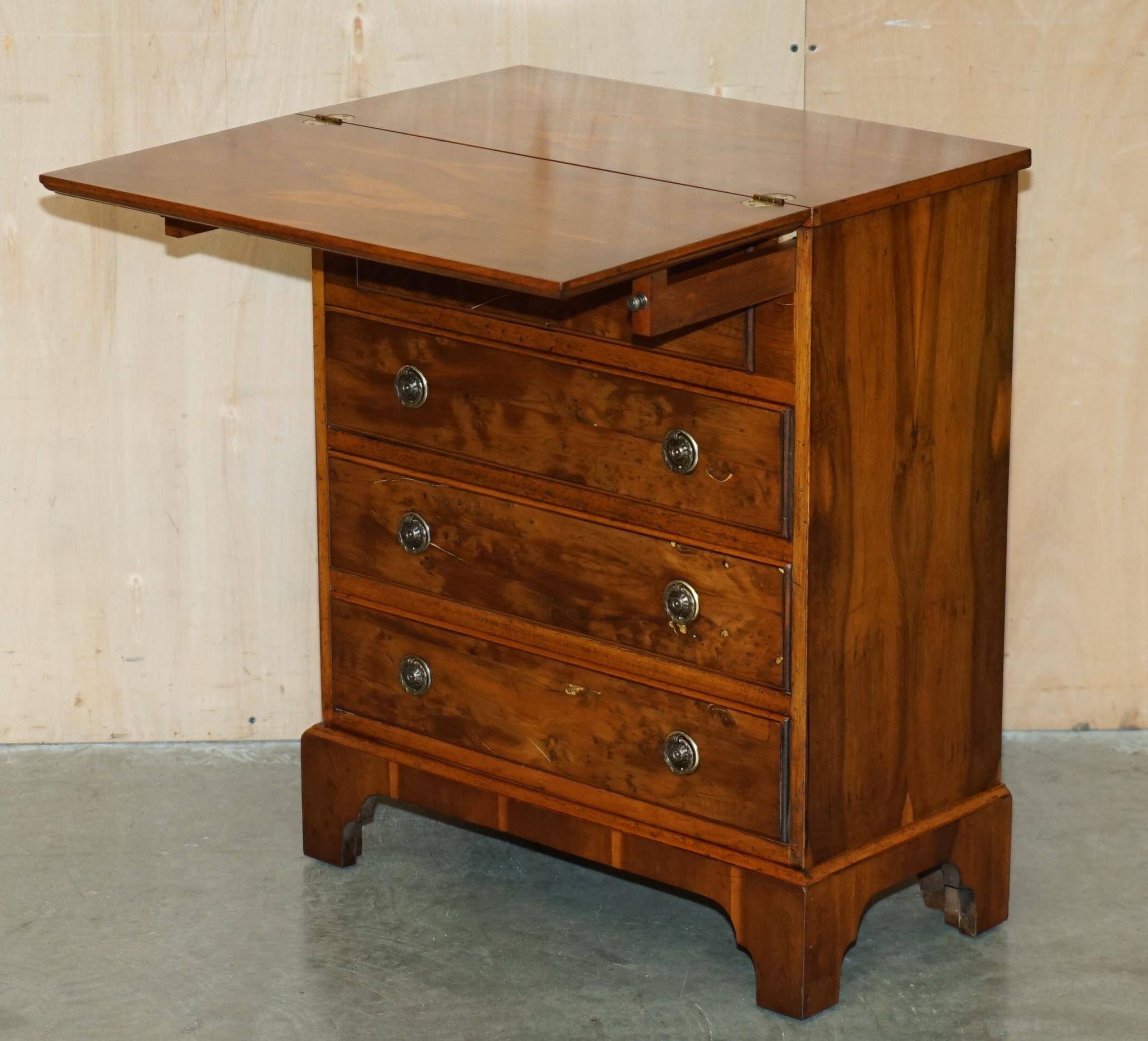 Vintage walnut commode with sliding top in Butler style.