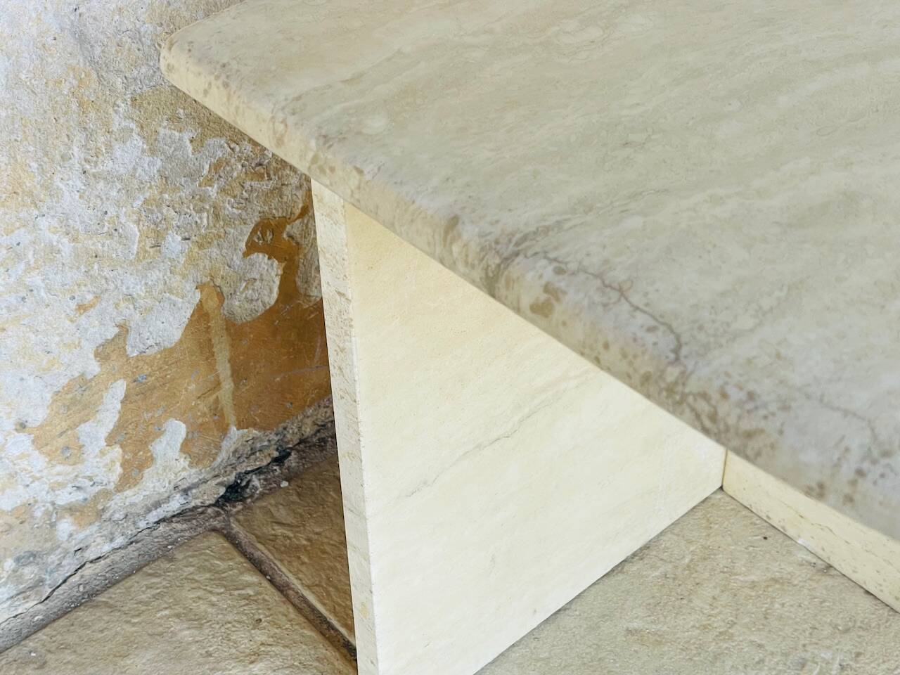 Vintage side table in travertine, circa 1980s.