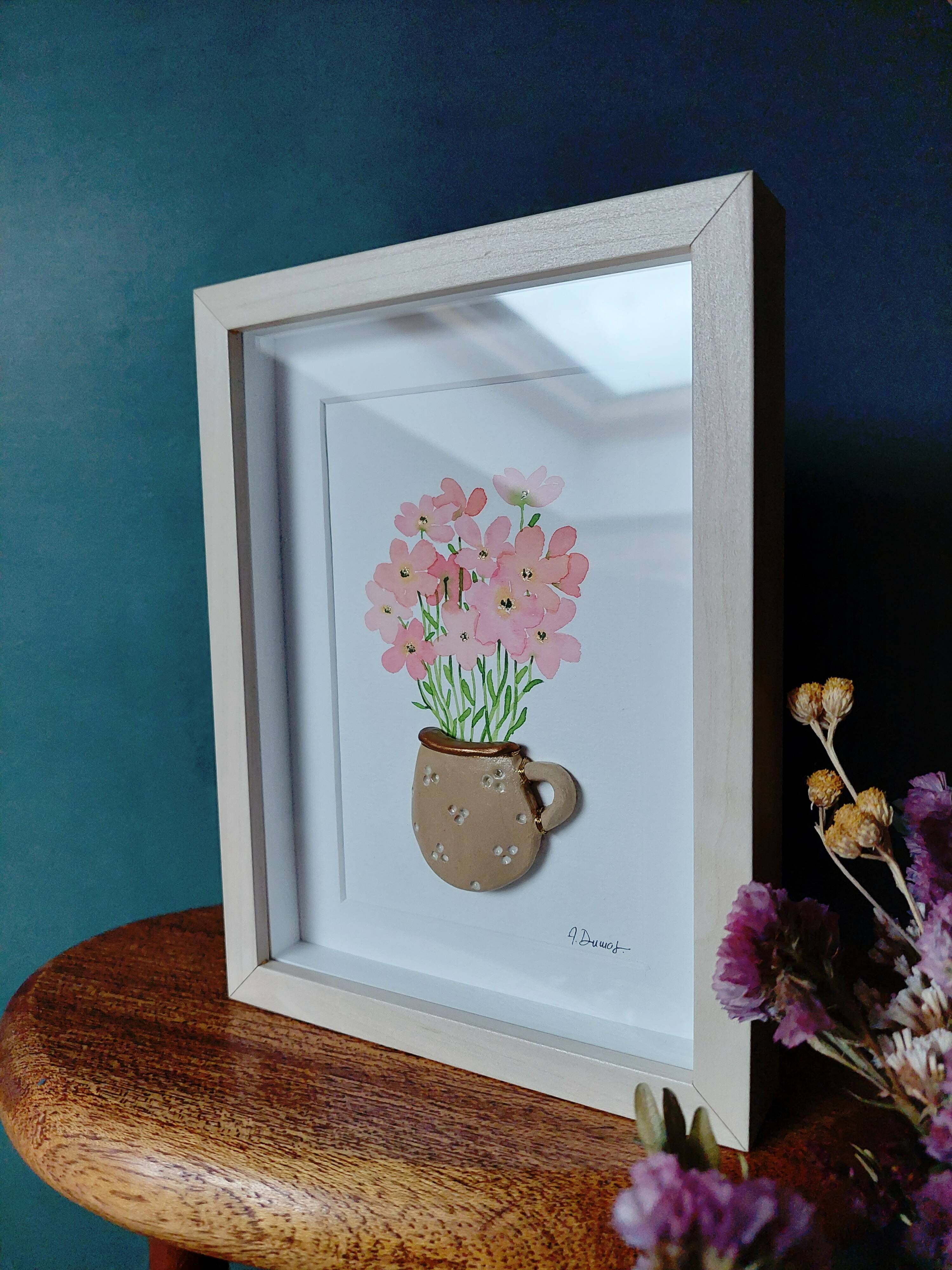 Relief painting bouquet of pink flowers in watercolor in a handmade clay mug
