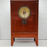 Antique red cabinet with brass details