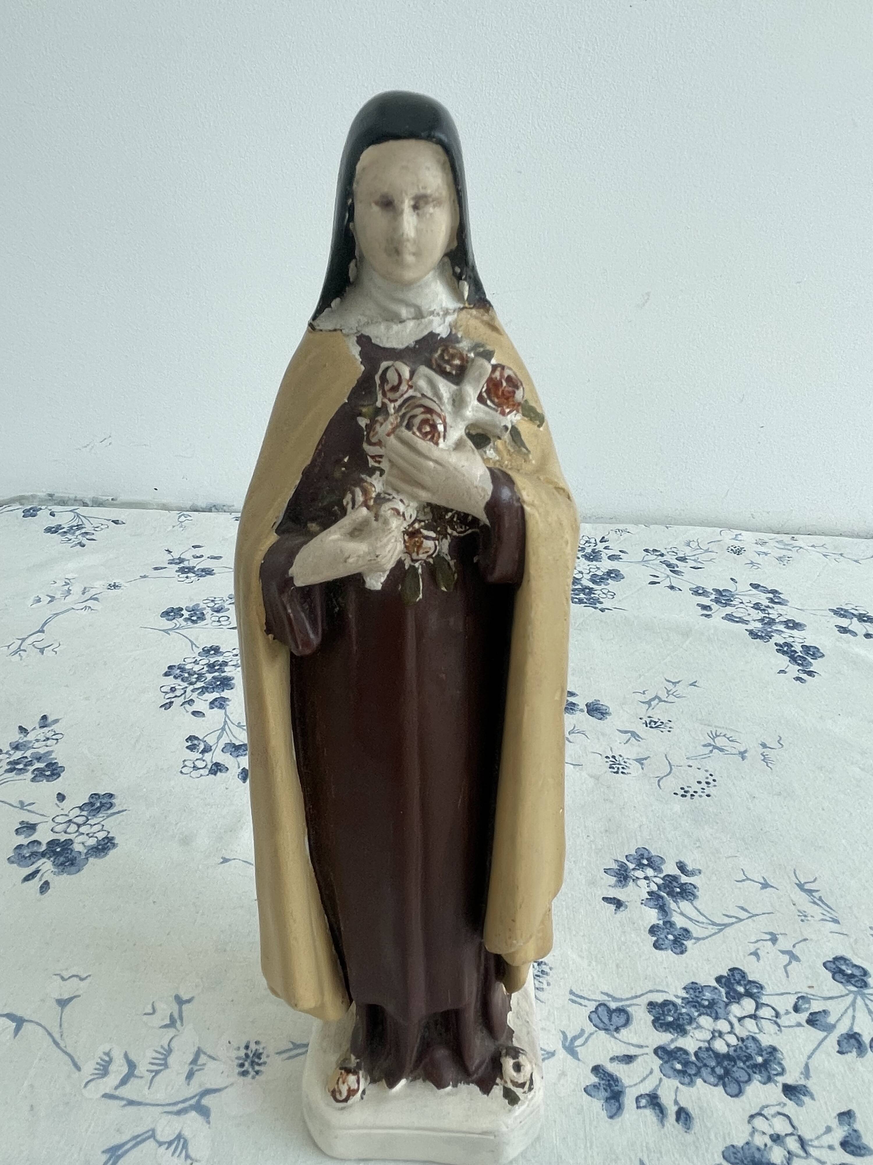 Antique statue of Saint Therese of Lisieux, religious plaster figurine