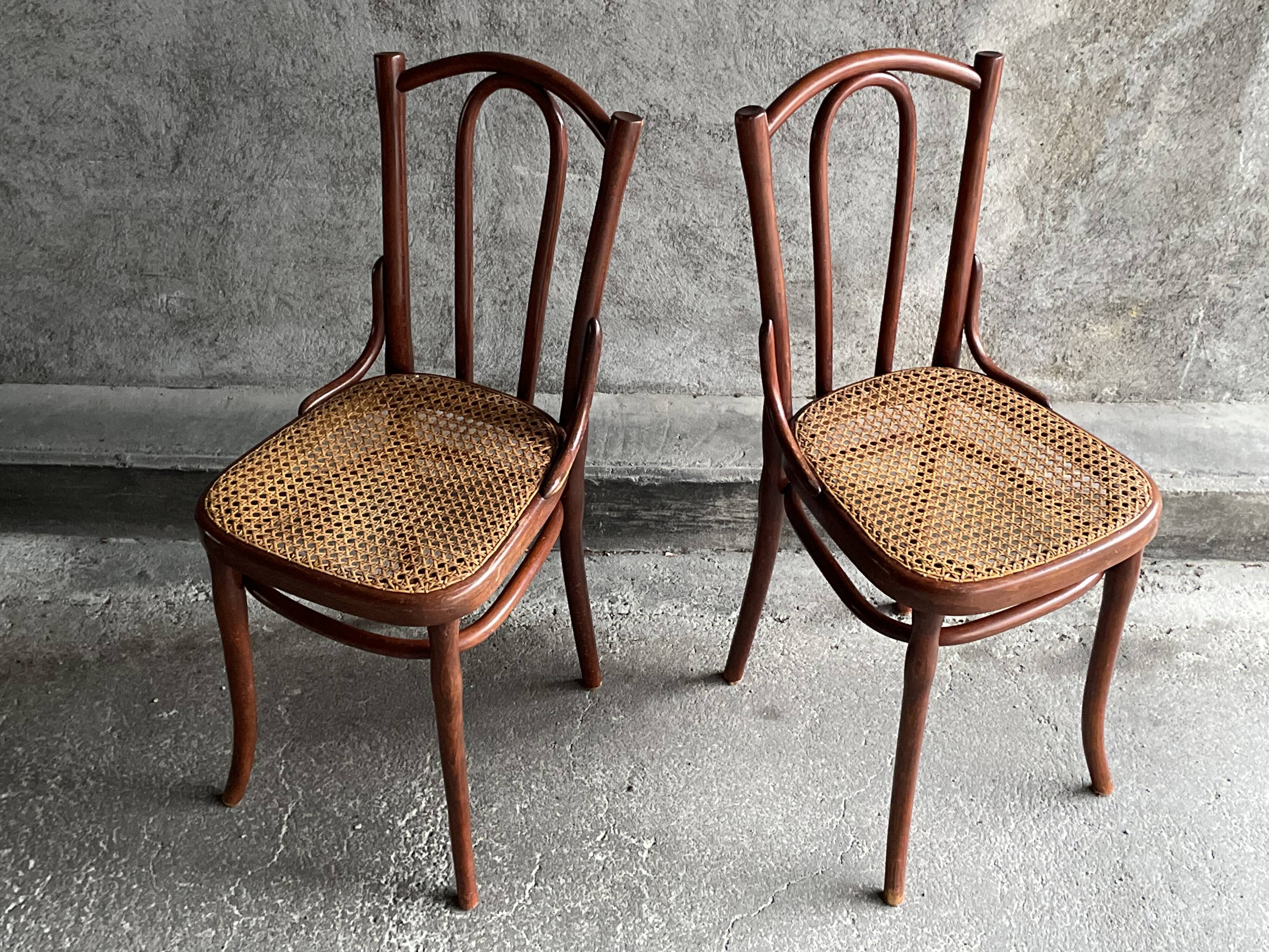 Pair of caned bistro chairs by Thonet
