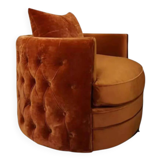 Swivel and upholstered velvet armchair