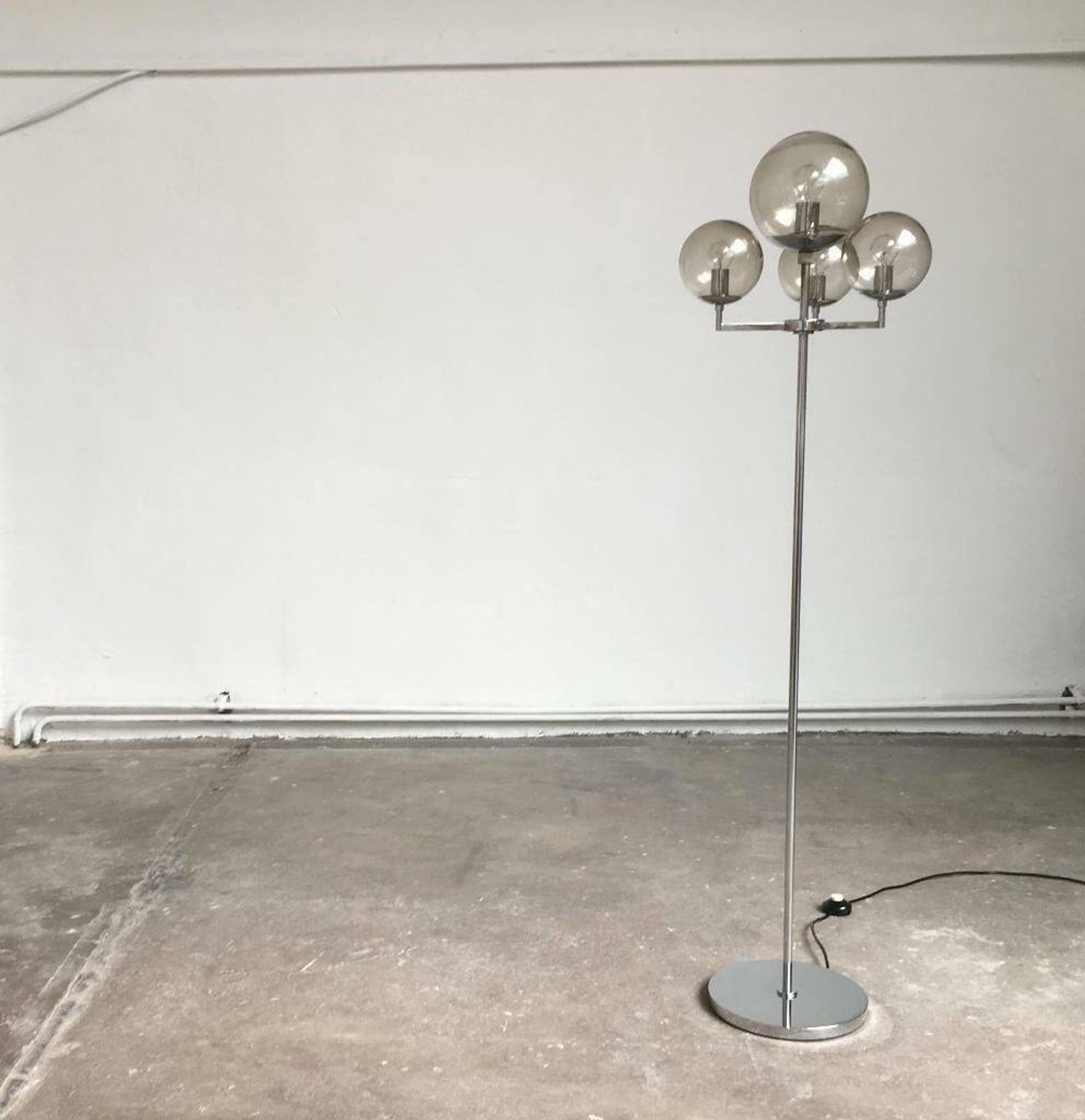 Chrome and glass floor lamp in mid-century German space style by Hustadt Leuchten, 1960s.