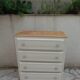 Vintage commode enhanced in beige, wooden top.