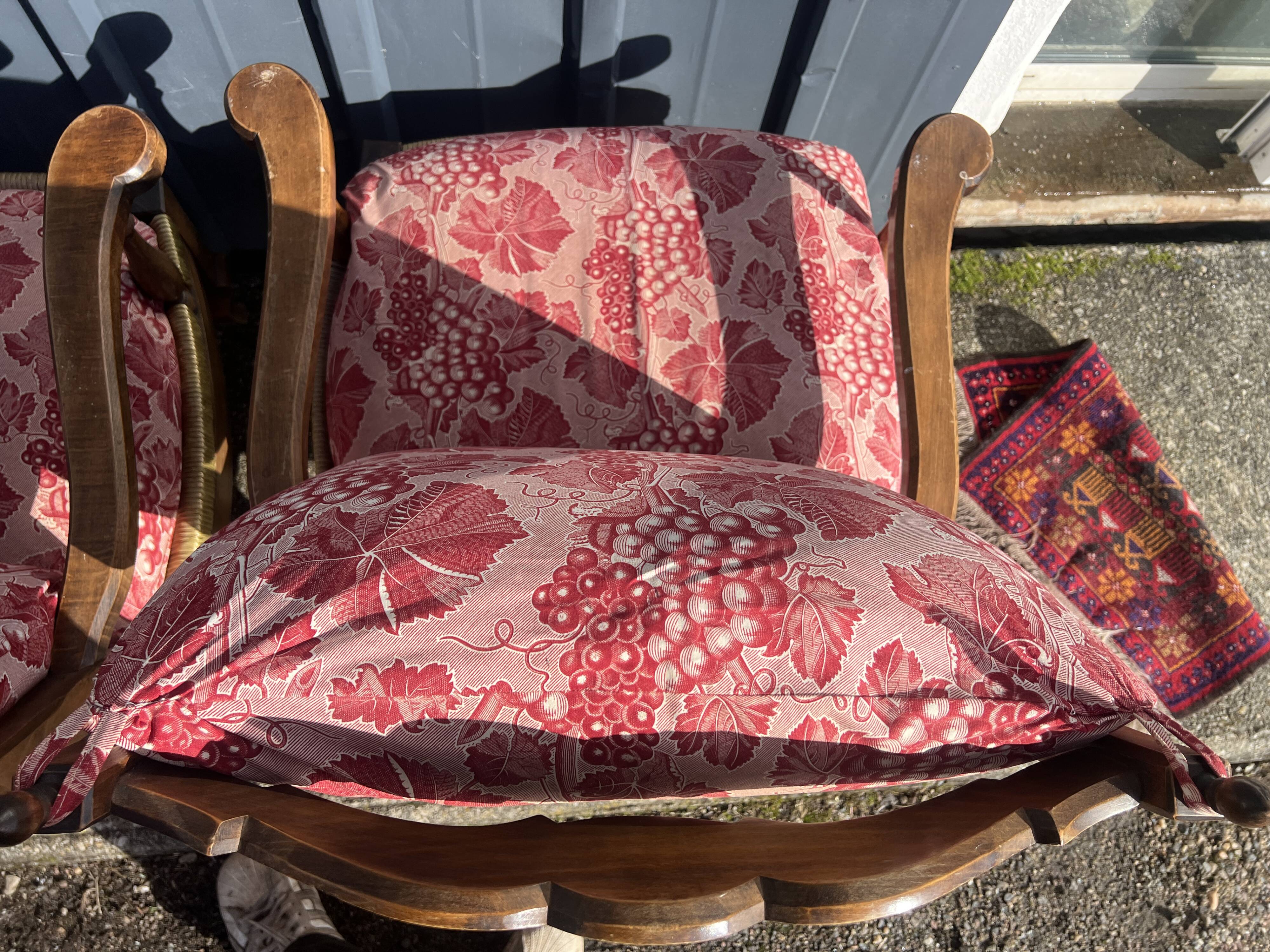 pair of rustic wood and fabric armchairs