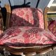 pair of rustic wood and fabric armchairs