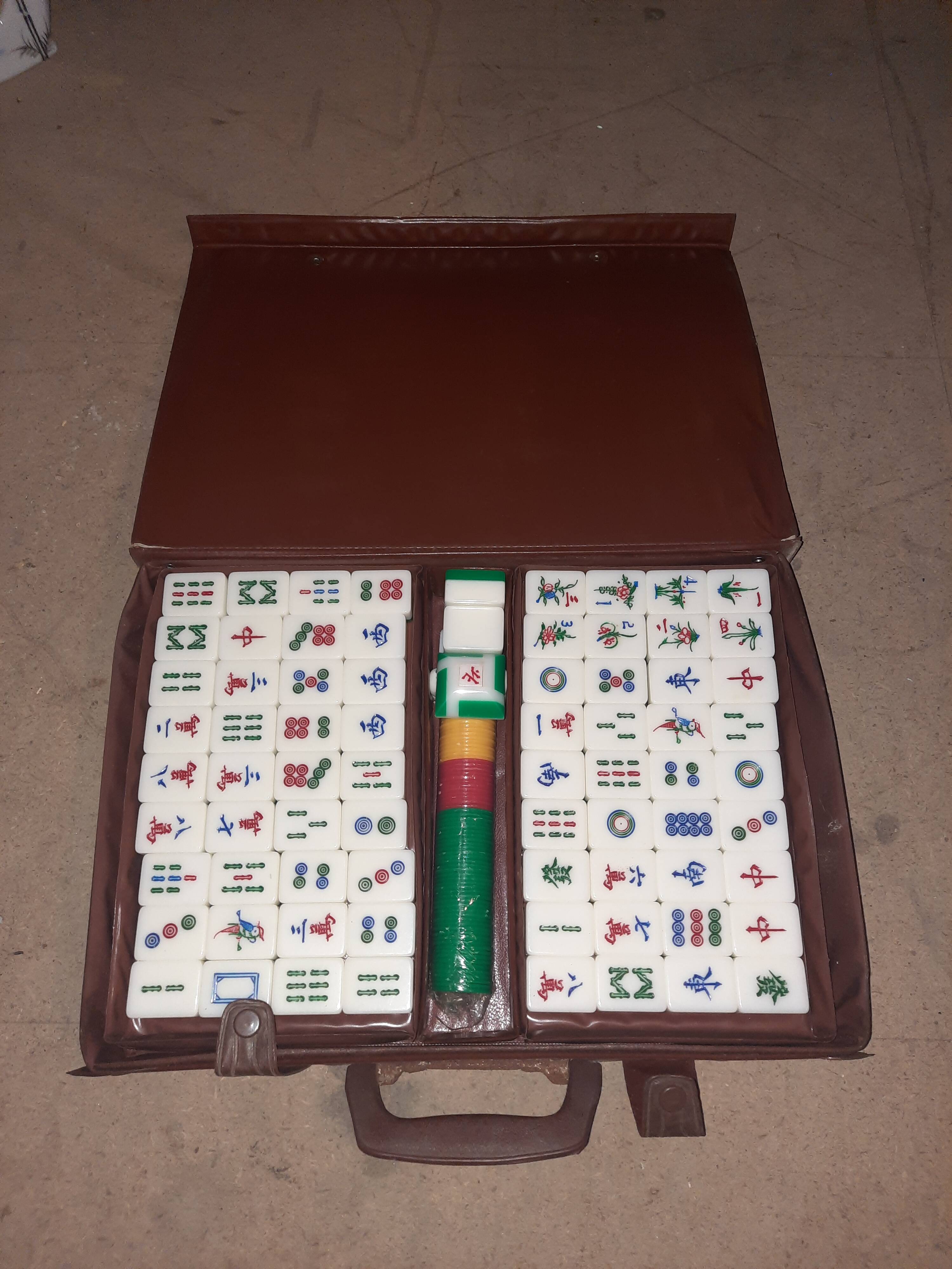 Complete vintage mahjong game with a faux leather case.