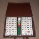 Complete vintage mahjong game with a faux leather case.