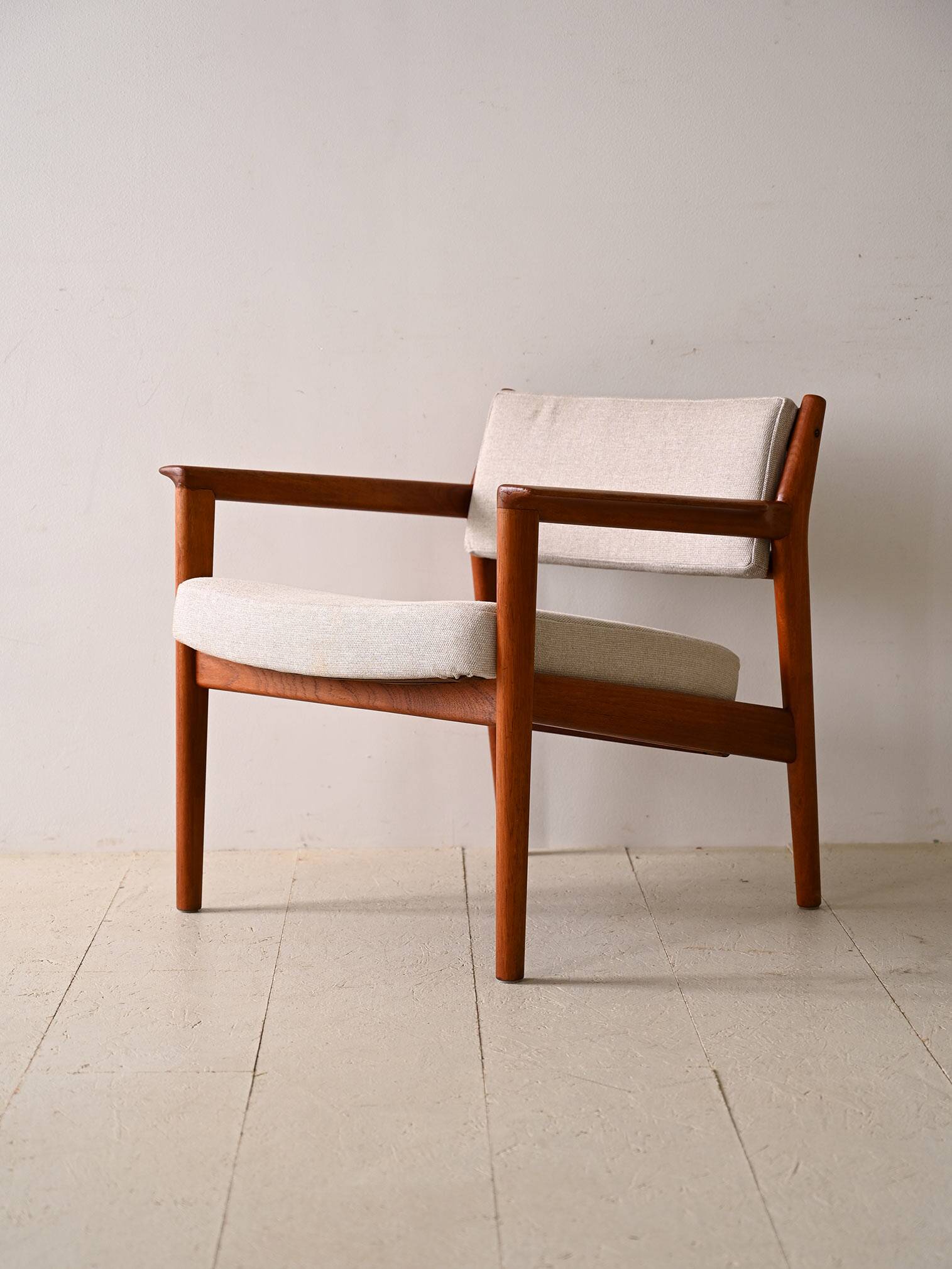 Upholstered armchair with teak frame