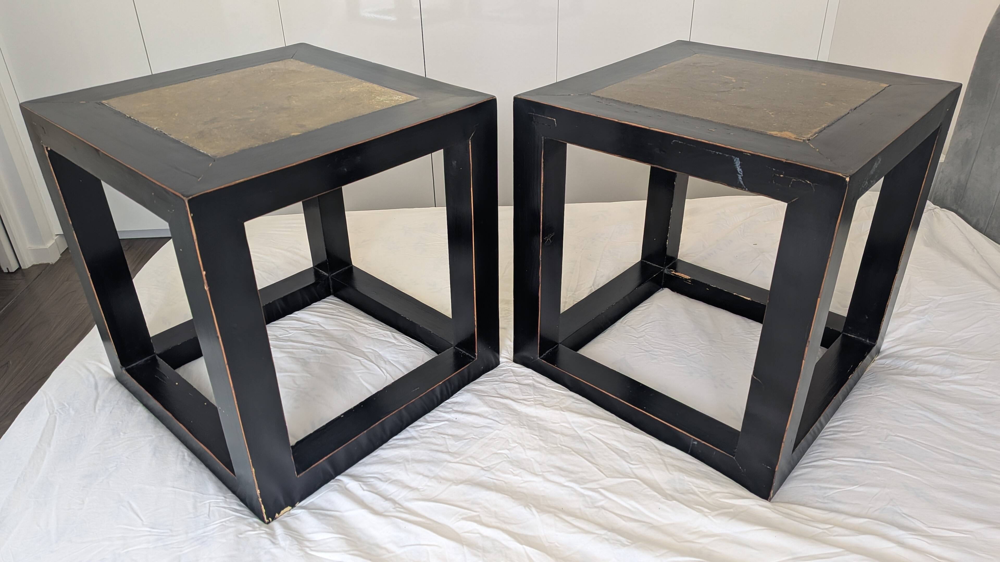 Chinese side tables in black lacquer, stone top.