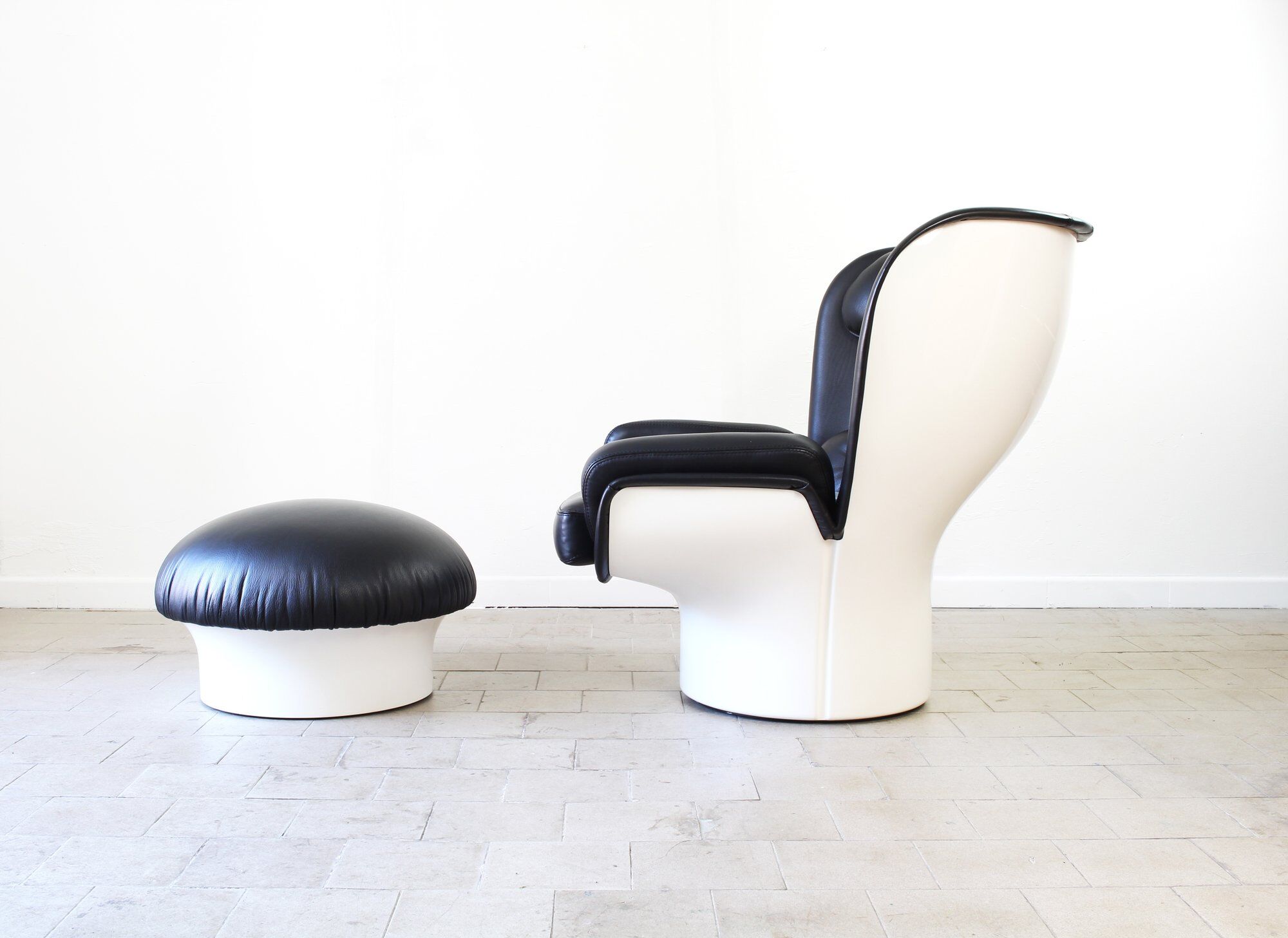 Joe Colombo Elda Chair + Ottoman in Black Leather and White Fiberglass Shell