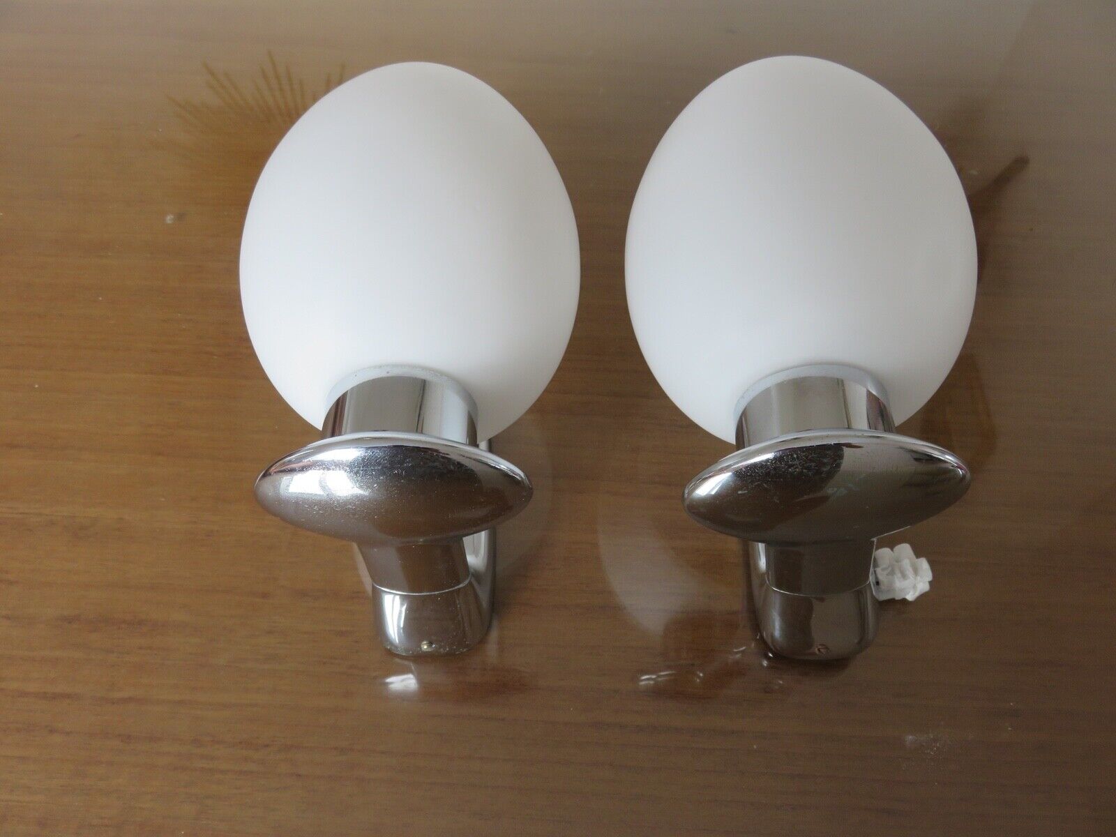 Wall lamps in chromed metal and opaline glass