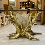 Round glass and brass table by designers Richard and Isabelle Faure