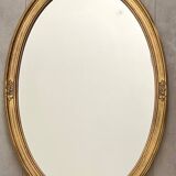 Oval mirror in carved wood