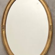 Oval mirror in carved wood