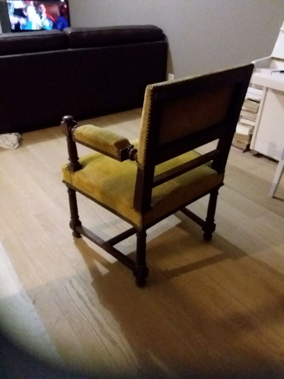 Mustard yellow wooden and velvet armchair