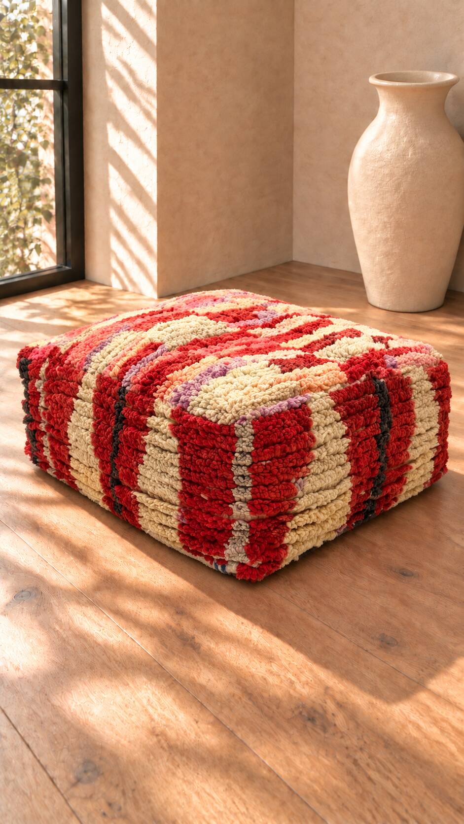 Vintage Moroccan pouf in multicoloured handmade wool.