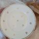 A lot of old white and gold porcelain plates T de F.