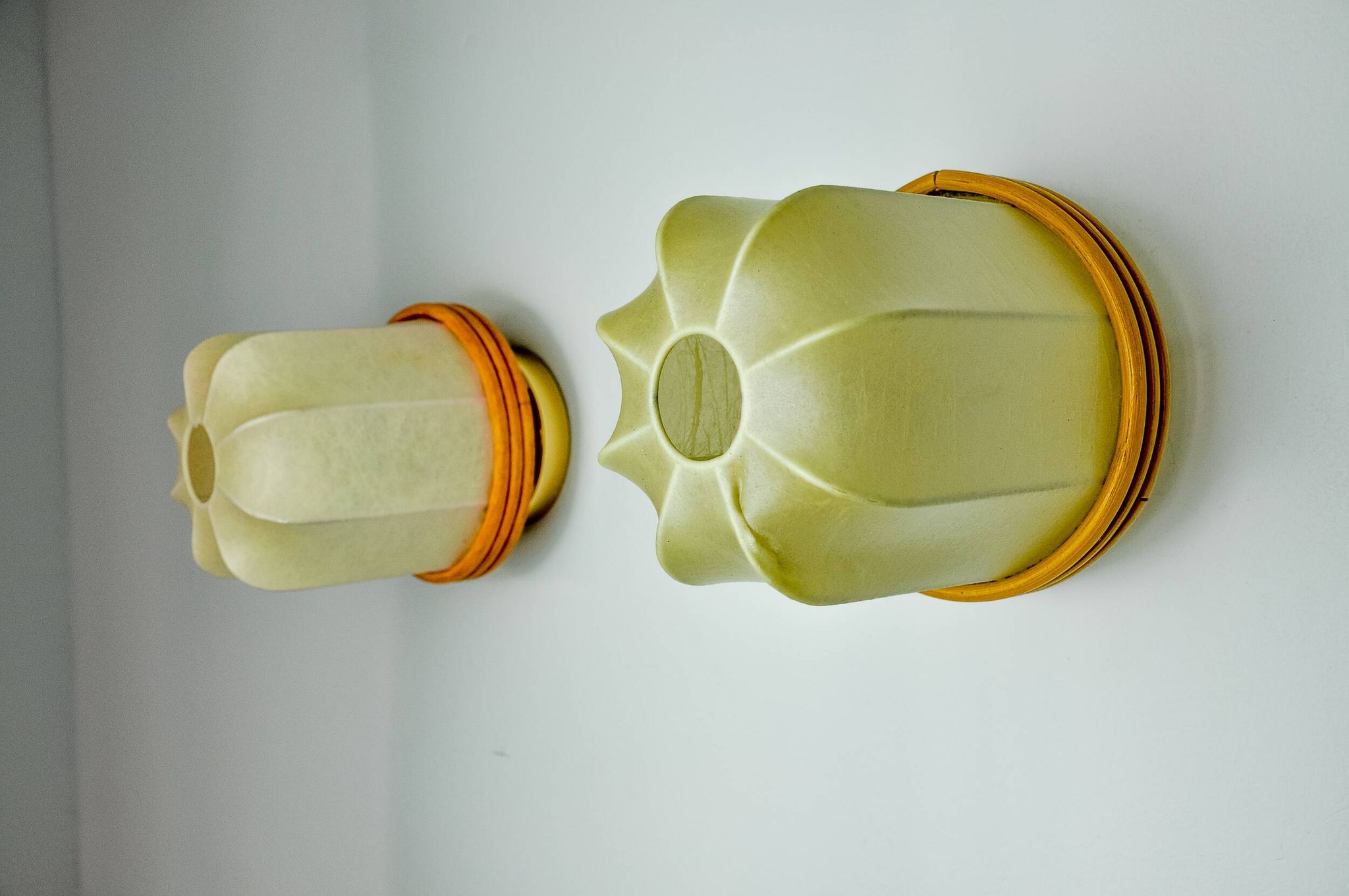 Pair of "cocoon" wall lights, resin and pine, Italy, 1970