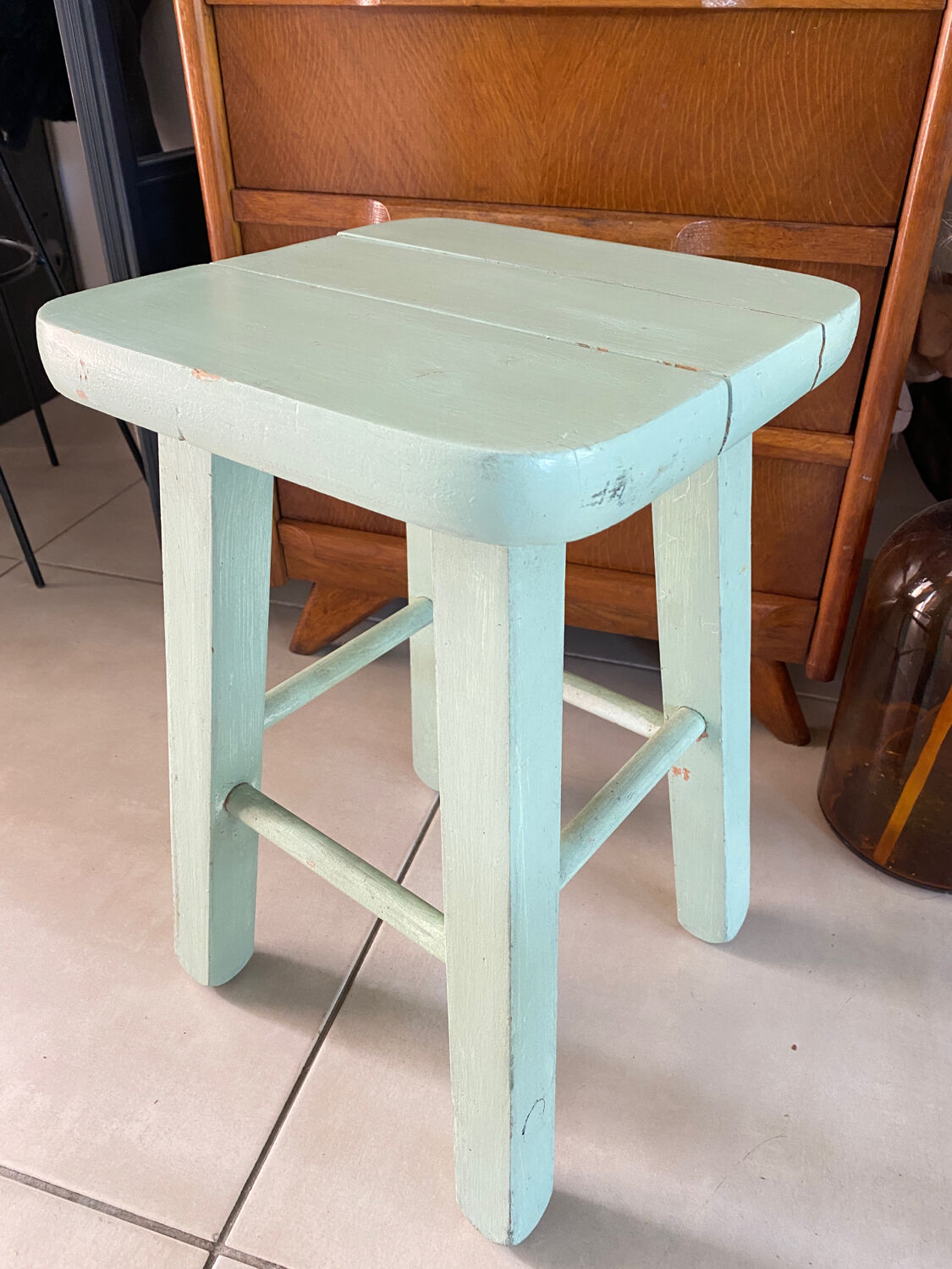 Old almond green wooden stool