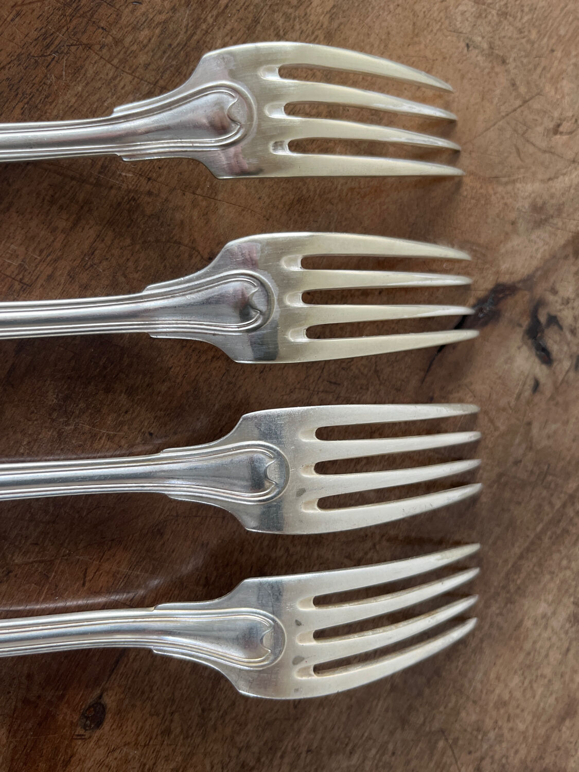 4 silver metal forks