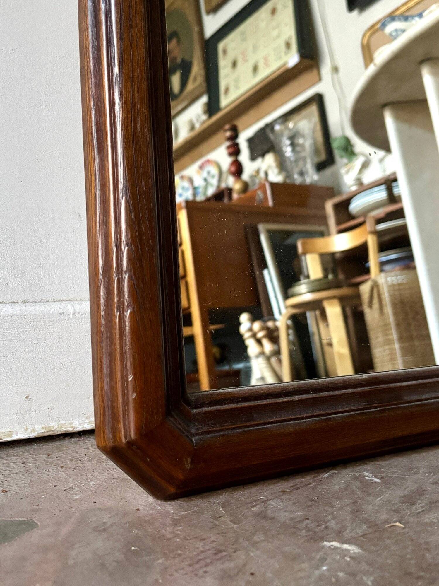 Full-length rectangular mirror in dark wood
