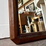 Full-length rectangular mirror in dark wood