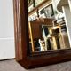 Full-length rectangular mirror in dark wood