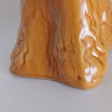 Ancient ceramic pitcher in the shape of a poodle.