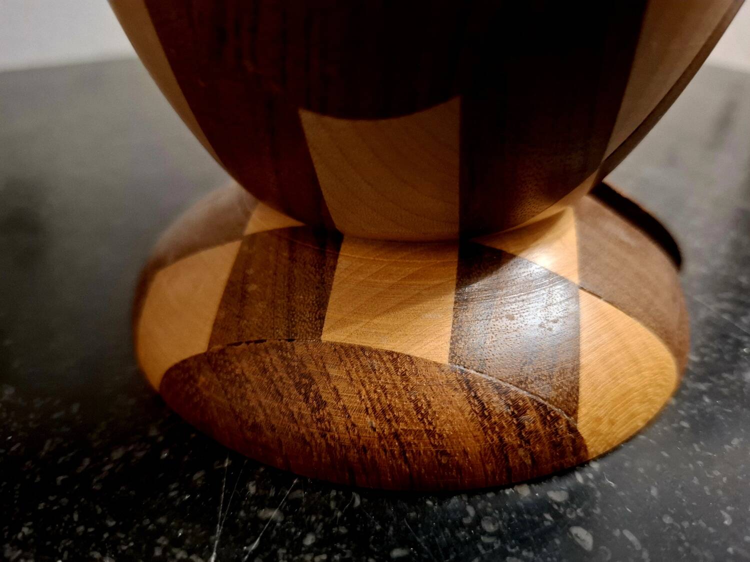 Bookends in exotic wood marquetry in the shape of a tambourine.
