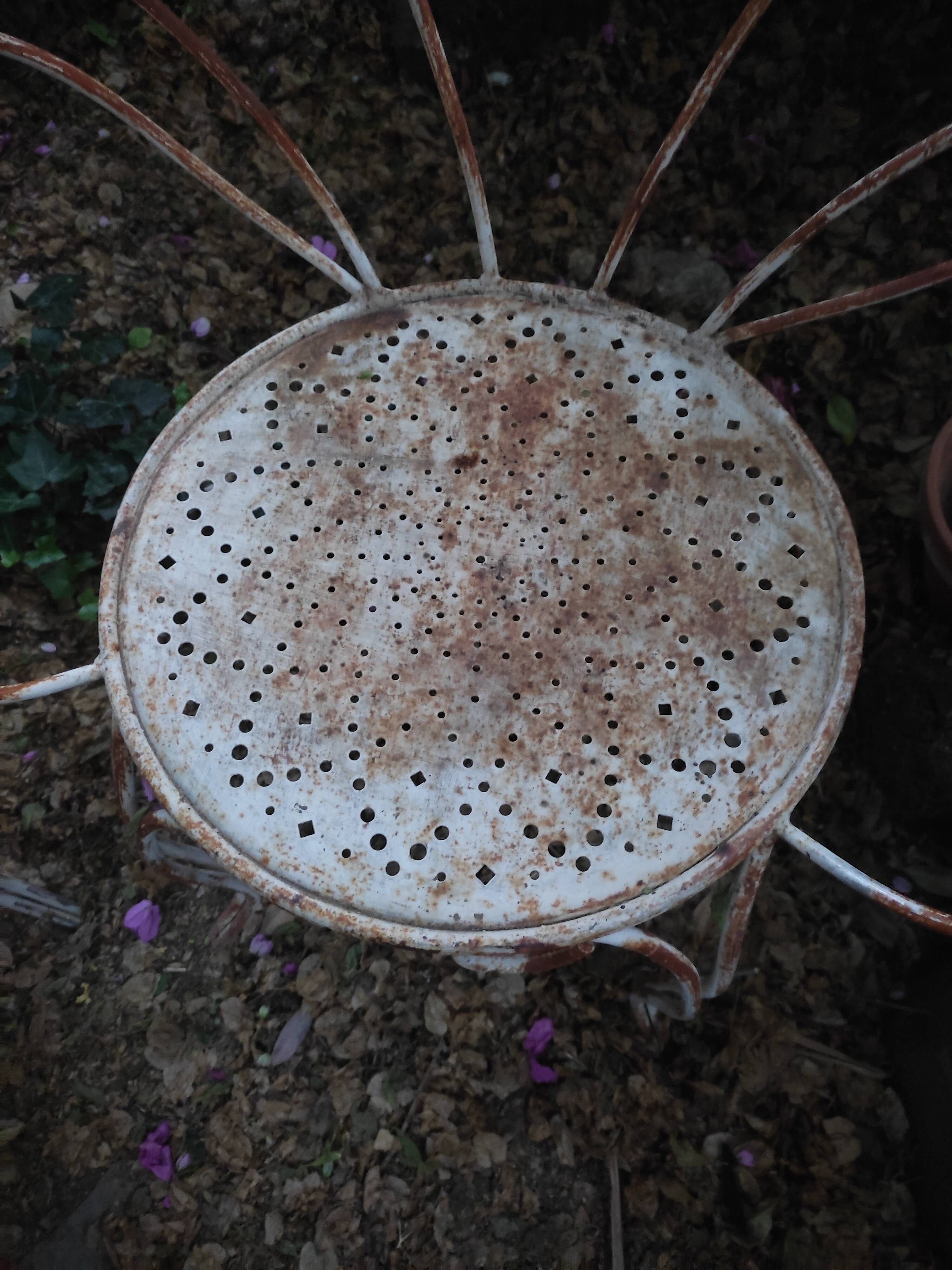 Duo of iron lawn chairs