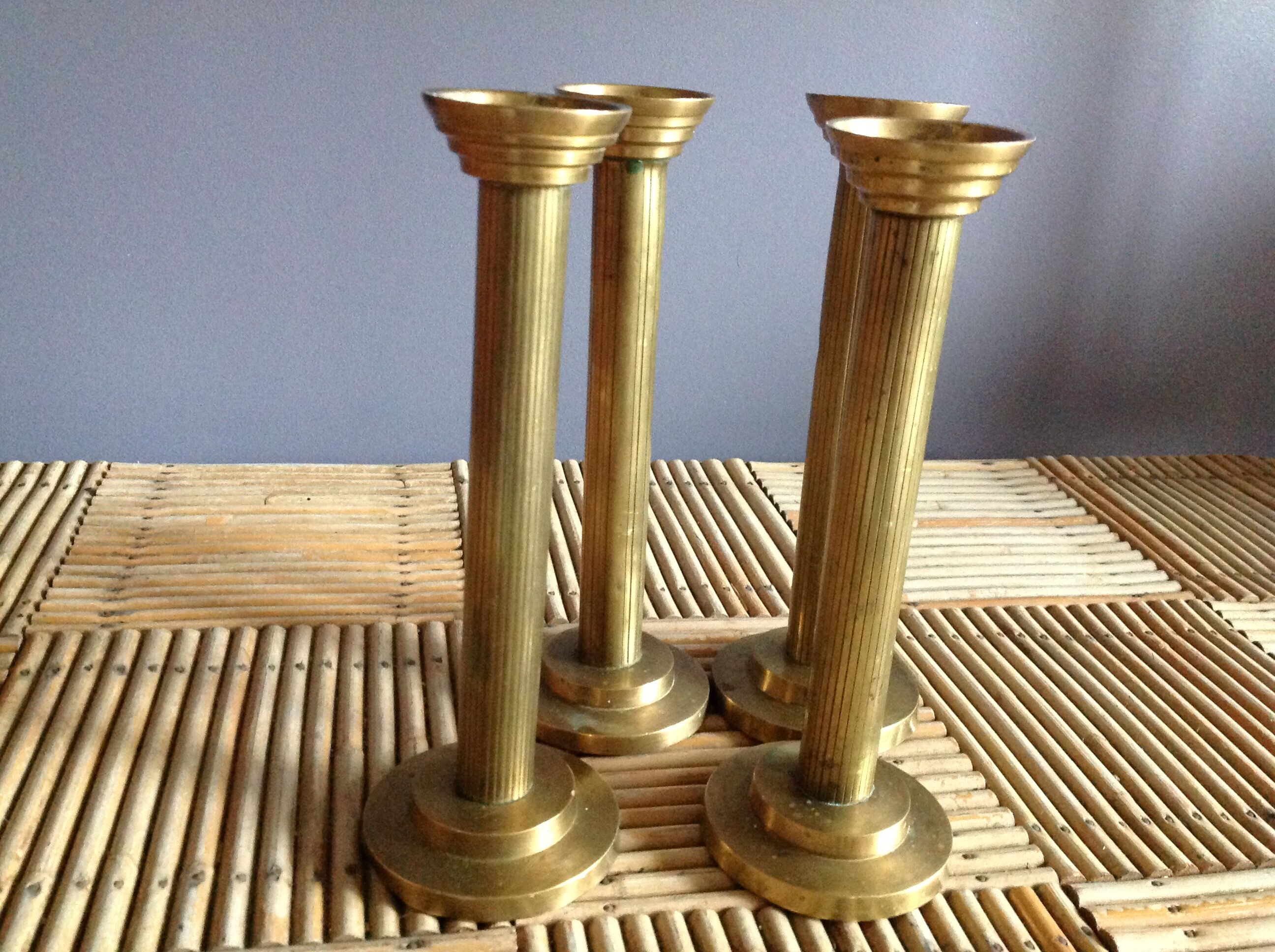 Series of 4 brass candlesticks