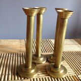 Series of 4 brass candlesticks
