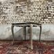 Game table in gray lacquered wood with white filling stamped gouffé