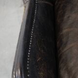 Set of 2 black cow leather armchairs finished with decorative nails, industrial style