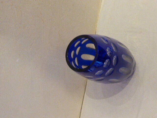 Blue and transparent glass vase, has vintage geometry patterns