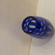 Blue and transparent glass vase, has vintage geometry patterns