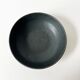 Round vintage black ceramic catchall.