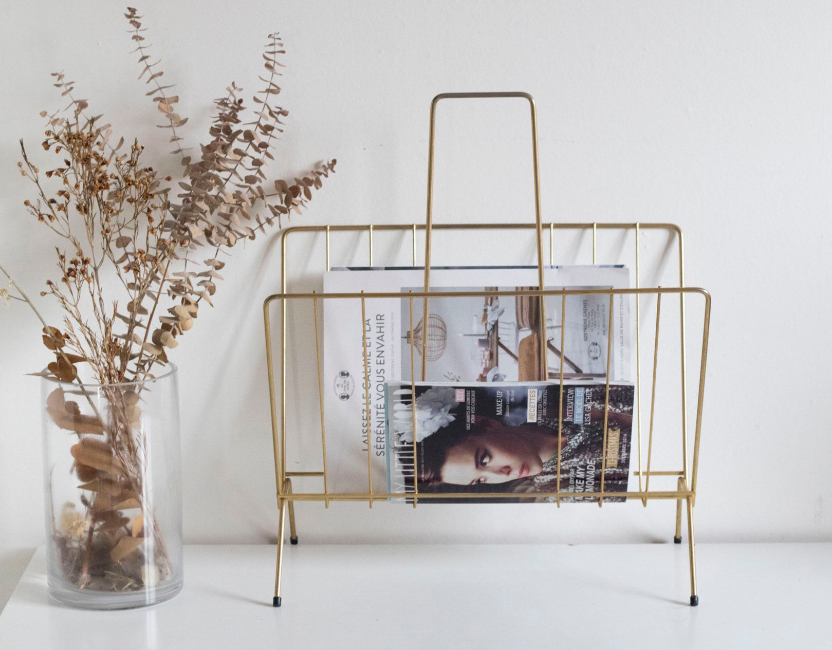 Vintage magazine holder in gold metal