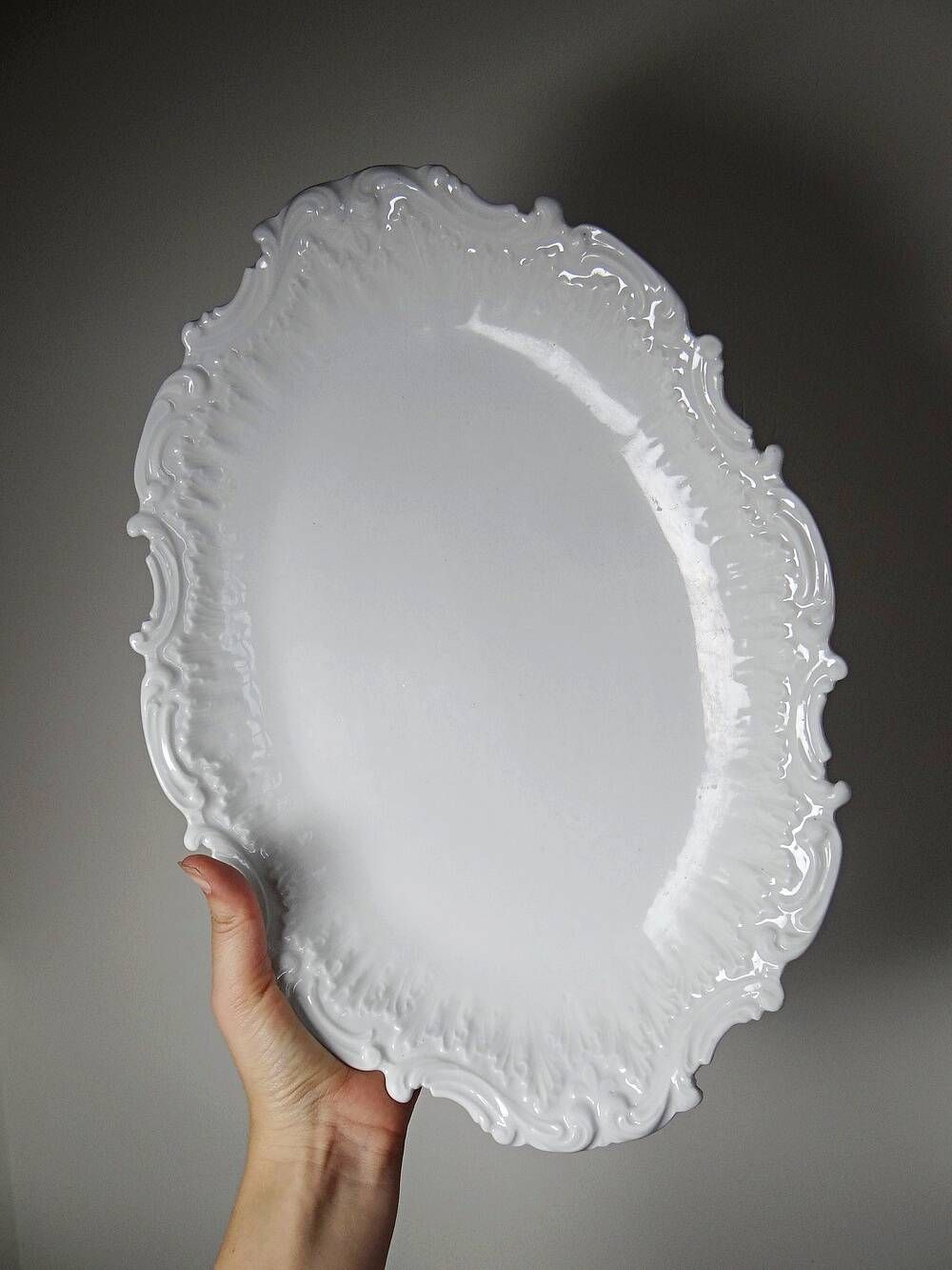 Antique deep dish in white Limoges porcelain, with rockwork relief.