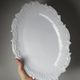 Antique deep dish in white Limoges porcelain, with rockwork relief.