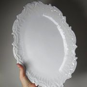 Antique deep dish in white Limoges porcelain, with rockwork relief.