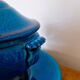 Blue ceramic soup tureen and crackled finish trivet.