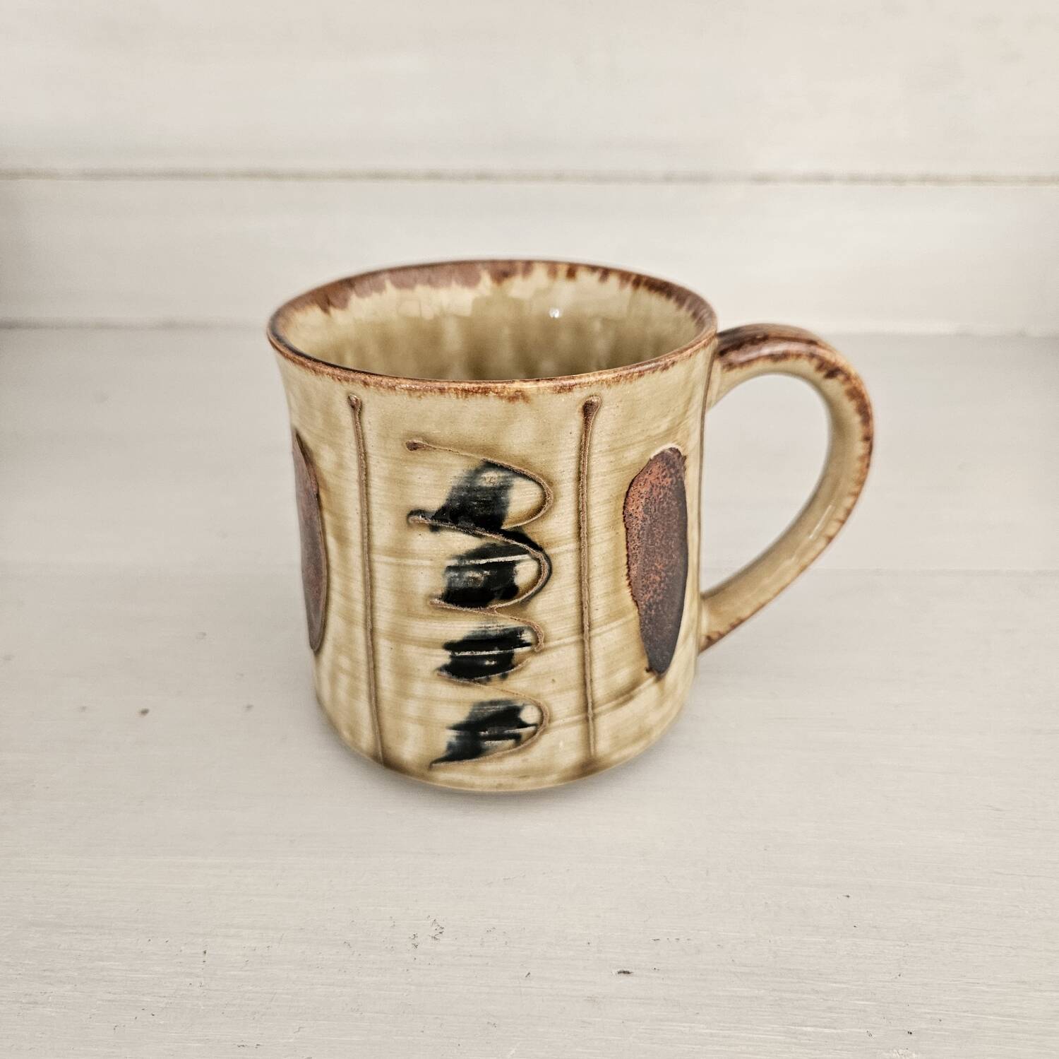 Set of 4 ceramic mugs, glazed stoneware, assorted vintage designs.