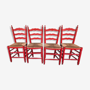 Suite de 4 chaises rouges en bois et paille