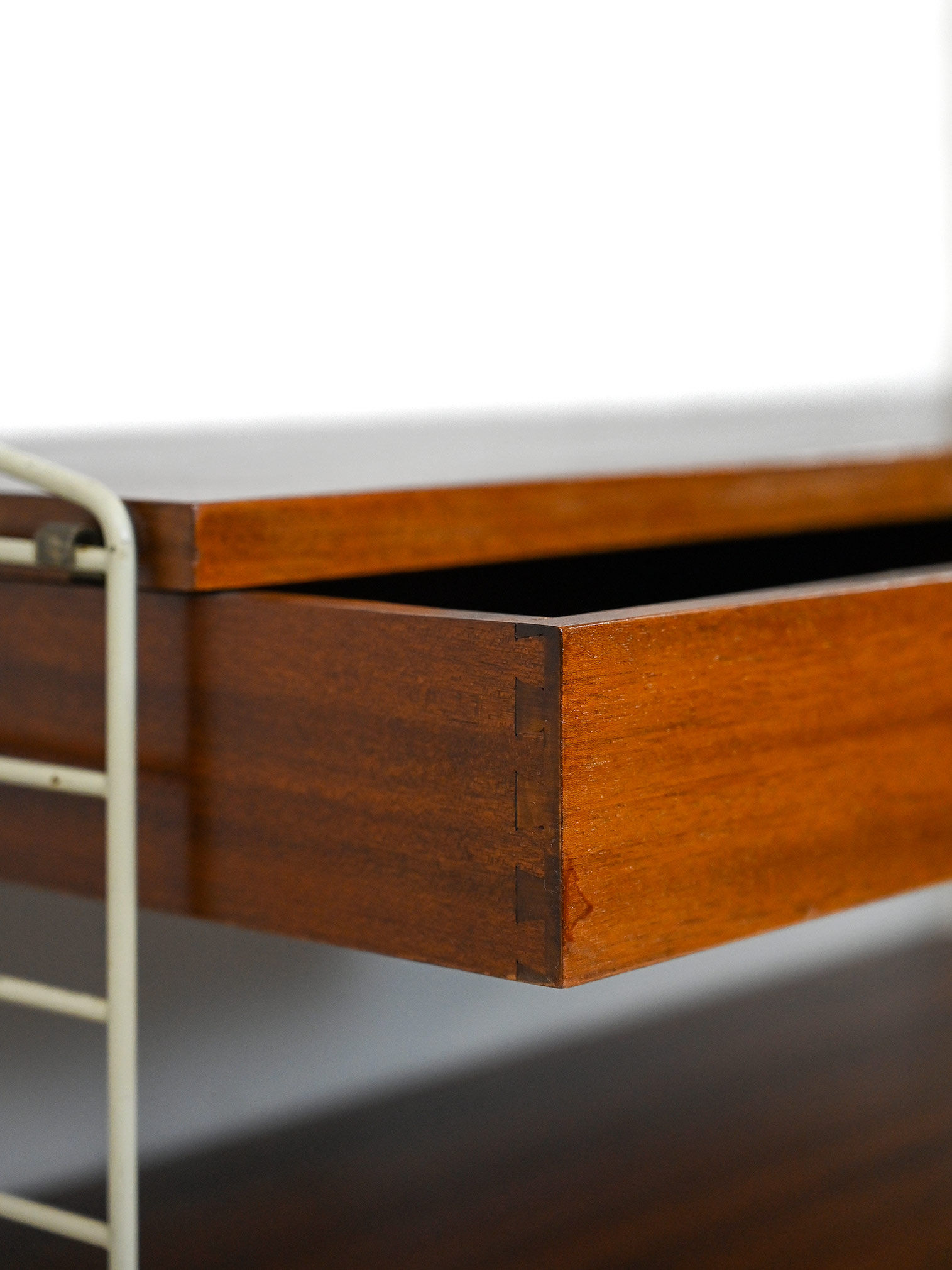 'string' bookcase with metal frame