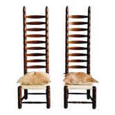 Paire de chaises espagnoles à dossier haut, datant du milieu des années 1900, avec des sièges en peau de chèvre et en lin.