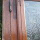 Oak entrance door and its frame and transom, wrought iron gates